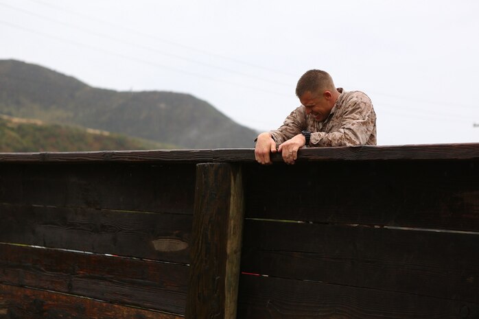 Master Sgt. David Jarvis, a reconnaissance Marine with 1st Reconnaissance Battalion, pushes over a wall during the obstacle course portion of the 7th Annual Recon Challenge aboard Marine Corps Base Camp Pendleton, Calif., May 15, 2015. Jarvis would go on to win the Recon Challenge with his partner, Capt. Patrick Zuber, a company commander for 1st Reconnaissance Battalion, with a time of 8 hours and 35 minutes.