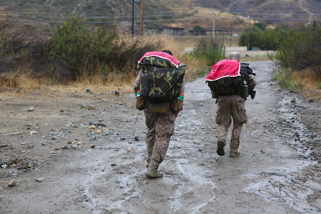 Competitors carried the banners of their fallen Marines on their rucks during the 7th Annual Recon Challenge aboard Marine Corps Base Camp Pendleton, Calif., May 15, 2015. The competitors carried the names of these Marines to instill brotherhood and make sure they are never forgotten.
