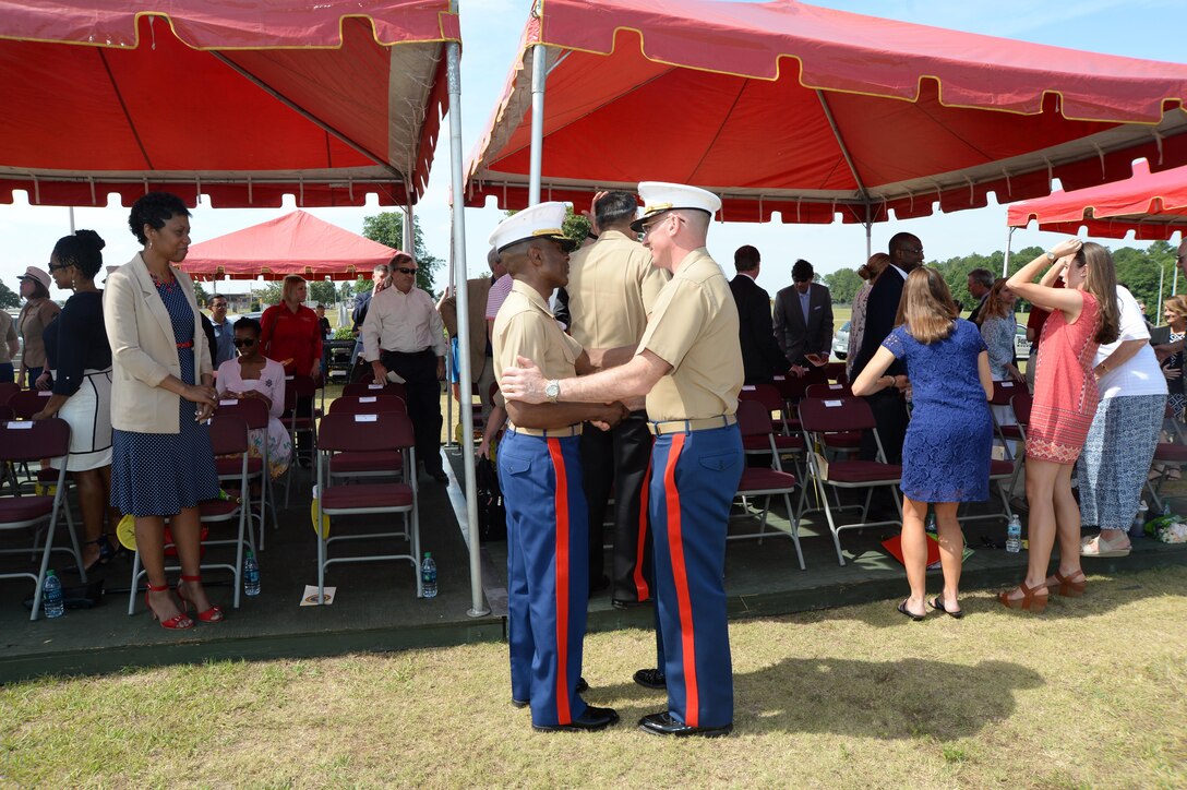 Lt. Col. James C. Carroll III, commanding officer, Marine Corps Logistics Base Albany, speaks with Col. Don Davis, outgoing commanding officer, MCLB Albany, during a change of command ceremony held May 28 on Schmid Field.