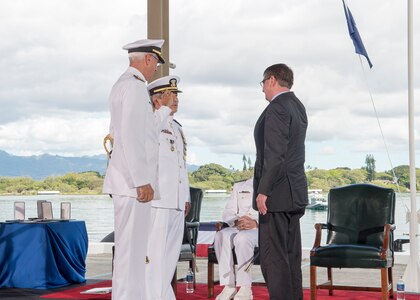 PEARL HARBOR (May 27, 2015) U.S. Pacific Command (USPACOM) and U.S. Pacific Fleet (USPACFLT) held a joint change of command ceremony at Joint Base Pearl Harbor-Hickam. During the dual ceremony, Adm. Scott H. Swift relieved Adm. Harry B. Harris Jr. as the PACFLT commander and Harris assumed command of USPACOM from Adm. Samuel J. Locklear III. 