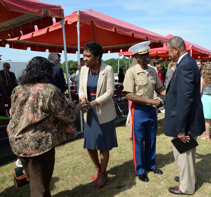 Lt. Col. James C. Carroll III, commanding officer, Marine Corps Logistics Base Albany, speaks to Rep. Sanford D. Bishop, Jr., Georgia's 2nd Congressional District, during a change of command ceremony held May 28 on Schmid Field.