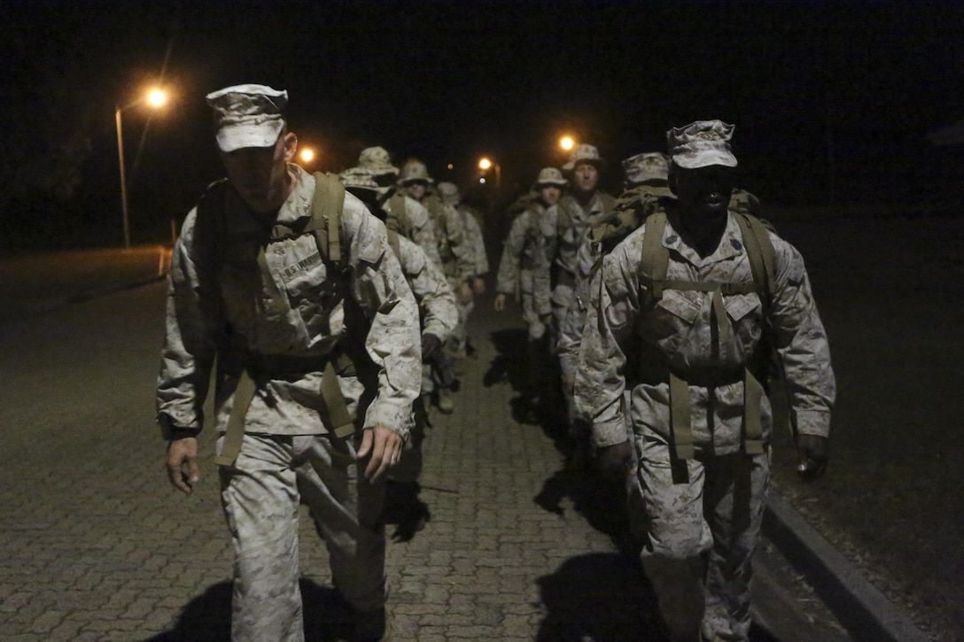 Lieutenant Colonel Eric Dougherty, left, and Sgt. Maj. Marcus Chestnut, right, lead Marines with 1st Battalion, 4th Marine Regiment, Marine Rotational Force – Darwin, in a battalion hike May 8 at Robertson Barracks, Palmerston, Northern Territory, Australia. MRF-D is comprised of a competent expeditionary fighting force that is technically proficient, culturally sensitive, and capable of responding to any crisis or contingency operation. The rotational deployment of U.S. Marines affords an unprecedented combined training opportunity with our Australian allies and improves interoperability between our forces. Dougherty is the commanding officer of 1st Battalion, 4th Marines, MRF-D. Chestnut is the sergeant major of 1st Battalion, 4th Marines, MRF-D.