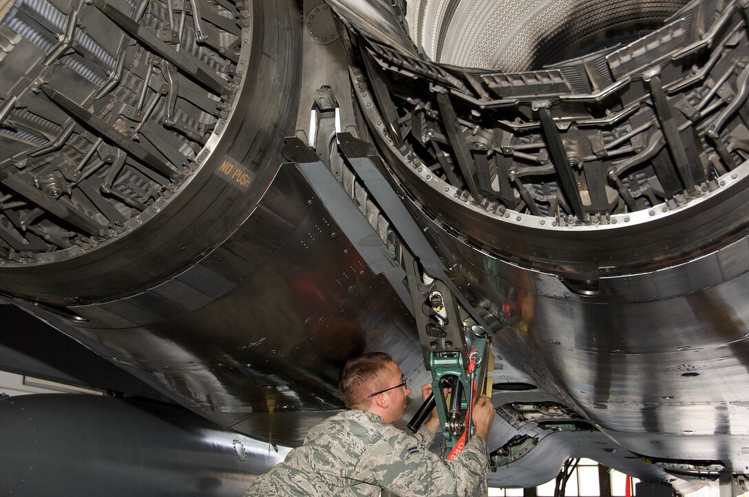 Airman 1st Class Zachery Dobsch, 362nd Training Squadron student, performs maintenance on the arresting hook damper on an F-15 Eagle air superiority fighter May 28, 2015, at Sheppard Air Force Base, Texas. Students learn to properly inspect, troubleshoot and service the arresting gear that will prepare them for operational environments and ready crew chiefs for real-world conflicts. (U.S. Air Force photo by Danny Webb/Released)