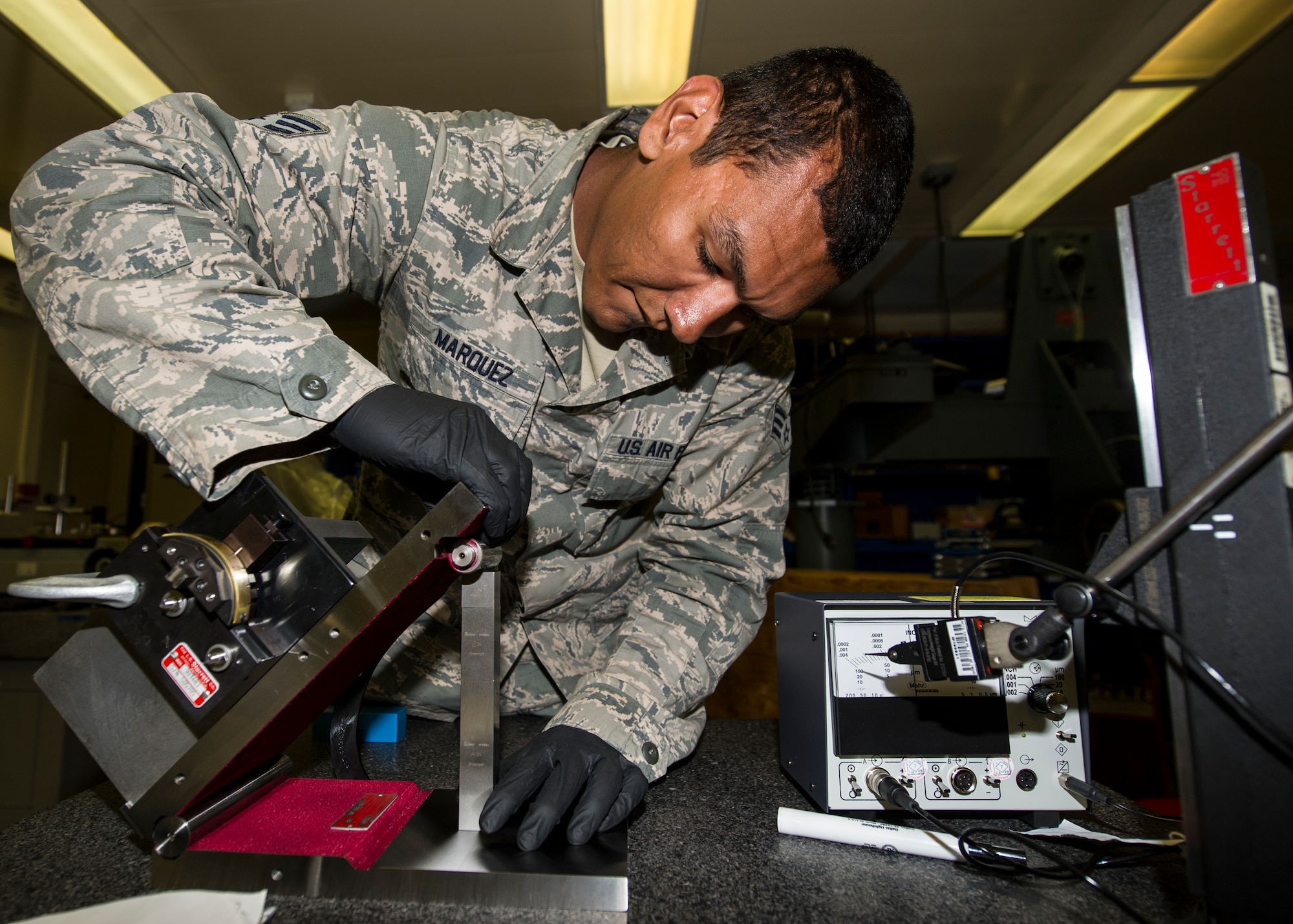 Senior Airman Troy Marquez, 49th Maintenance Squadron Precision Measurement Equipment Laboratory technician, creates a 45 degree angle to use as a reference to check levels at Holloman Air Force Base, N.M. May 28, 2015. Levels are marked with hash marks, which indicate a deviation from a horizontal reference point. Levels are often used in construction and are essential in ensuring building equipment are created at proper angles to ensure safe, sturdy building. (U.S. Air Force photo by Airman 1st Class Emily A. Kenney/Released)
