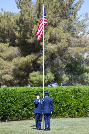 Members of the Nellis Air Force Base Honor Guard raise
the American flag to full-staff during a Memorial Day
ceremony at the Davis Funeral Homes and Memorial
Park in Las Vegas, May 25. The proper protocol for
flying the American Flag on Memorial Day slightly
differs from other occasions; on Memorial Day, flags
are flown at half-staff from sunrise until noon only,
and then raised quickly to full-staff. (U.S. Air Force photo by Lorenz Crespo)  