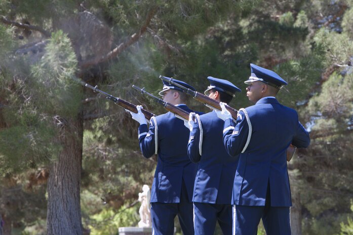 The Nellis Air Force Base Honor Guard performs a 21-gun salute during a Memorial Day ceremony at the Davis Funeral Homes and Memorial Park in Las Vegas, May 25. On Memorial Day, a salute of 21 guns is fired at noon while the flag is flown at half-staff. (U.S. Air Force photo by Lorenz Crespo)  