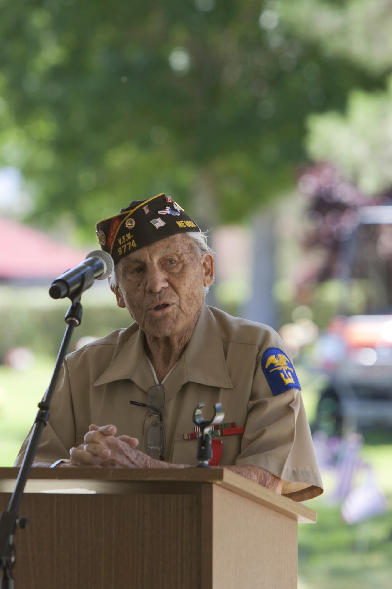 Gaetano Benza, 90-year old World War II veteran, delivers opening
remarks during the Memorial Day celebration at the Davis Funeral
Homes and Memorial Park in Las Vegas, May 25. Members of the local
community in attendance celebrated and reflected on the brave
sacrifices of those who gave their lives during foreign wars. (U.S. Air Force photo by Lorenz Crespo)  