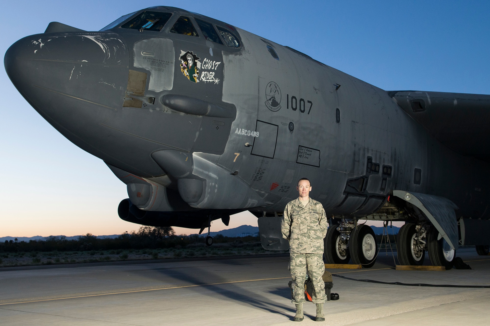 Tech. Sgt. Suann Becton, 507th Maintenance Squadron poses in front of B-52 aircraft number 61-007 which she helped bring back from the Boneyard in both civilian and Air Force Reserve status.  The B-52 dubbed the Ghost Rider flew from Davis-Monthan Air Force Base, Arizona back to Barksdale Air Force Base, Louisiana after the maintenance team brought it back to life. (Courtesy Photo) 