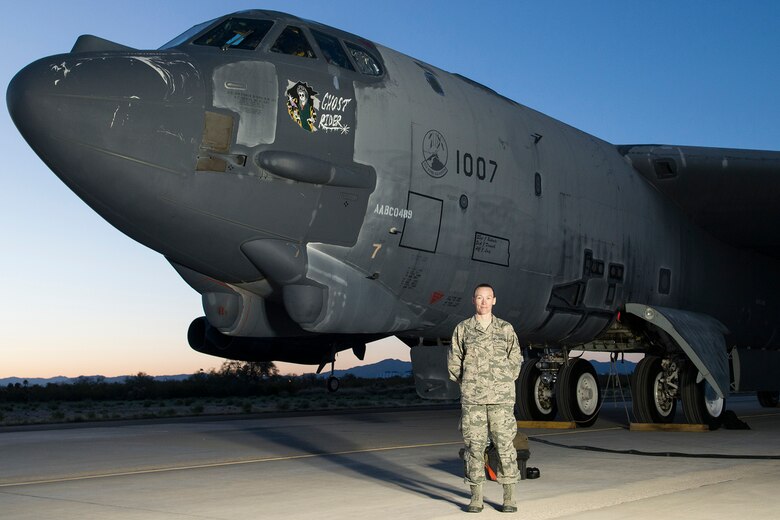 Tech. Sgt. Suann Becton, 507th Maintenance Squadron poses in front of B-52 aircraft number 61-007 which she helped bring back from the Boneyard in both civilian and Air Force Reserve status.  The B-52 dubbed the Ghost Rider flew from Davis-Monthan Air Force Base, Arizona back to Barksdale Air Force Base, Louisiana after the maintenance team brought it back to life. (Courtesy Photo) 
