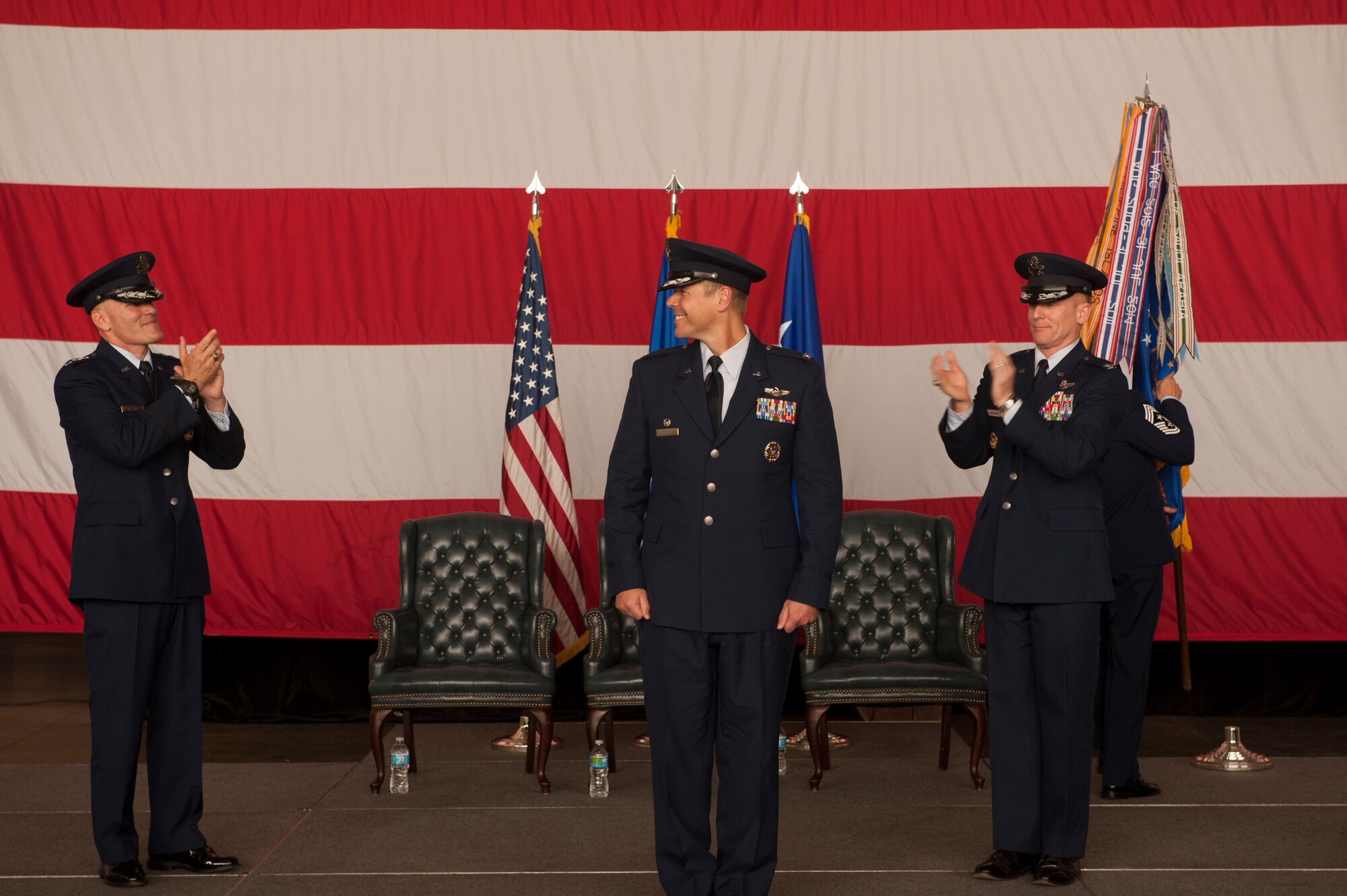 Lt. Gen. Carlton D. Everhart II, 18th Air Force commander (left), along with Col. Patrick Rhatigan, former 19th Airlift Wing commander (far right), congratulate Col. Charles Brown Jr. (center), the 19th Airlift Wing commander, May 27, 2015, at Little Rock Air Force Base, Ark. Brown’s previous assignment was as assistant deputy director, Joint Strategic Planning, Strategic Plans and Policy, Joint Staff, the Pentagon, Washington, D.C. (U.S. Air Force photo by Senior Airman Scott Poe)