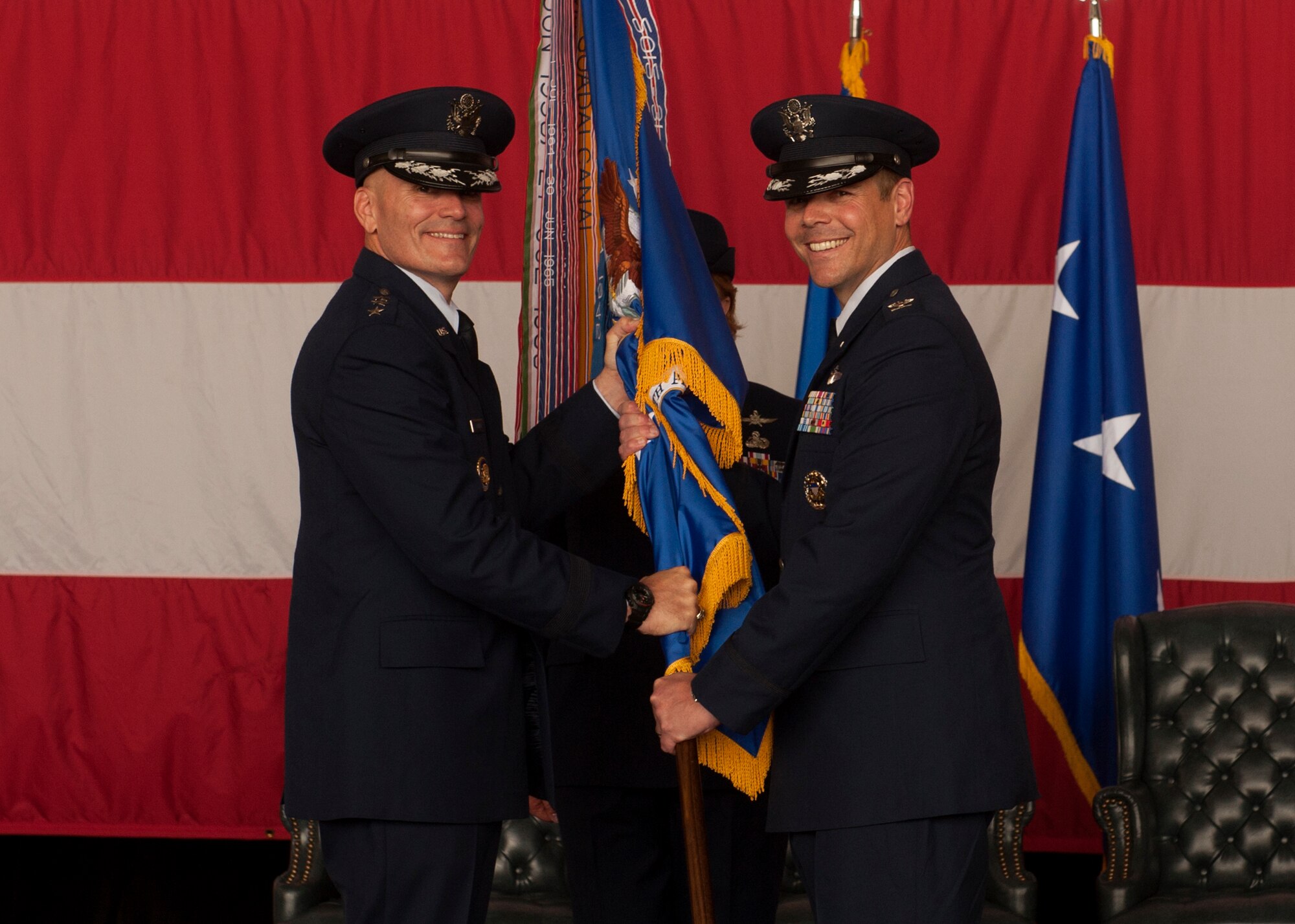 Col. Charles Brown Jr. accepts the 19th Airlift Wing guidon from Lt. Gen. Carlton D. Everhart II, 18th Air Force commander, assuming command of the 19th Airlift Wing May 27, 2015, at Little Rock Air Force Base, Ark. Col. Brown is a senior pilot with more than 1,600 hours in the F-15E, C-130E and C-130H. (U.S. Air Force photo by Senior Airman Scott Poe) 