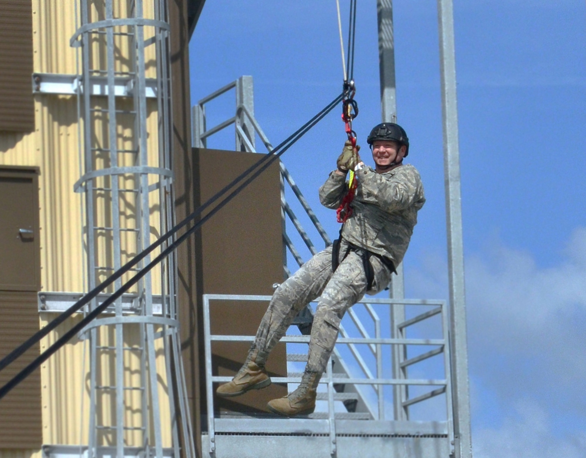 Maj. Gen. Richard Scobee, 10th Air Force commander, zips down a high line traverse provided by 920th Rescue Wing Guardian Angels. The GA’s (pararescuemen, combat rescue officers and survive, evade, resist and escape technicians) are among the most highly trained emergency trauma specialists in the U.S. military. They must maintain an emergency medical technician-paramedic qualification throughout their careers. With this medical and rescue expertise, along with their deployment capabilities, PJs are able to perform life-saving missions in the world's most remote areas.   Scobee visited the Rescue Wing to familiarize himself with the missions and heroes of his rescue and special operations components. (Air Force photo/Master Sgt. Paul Flipse)