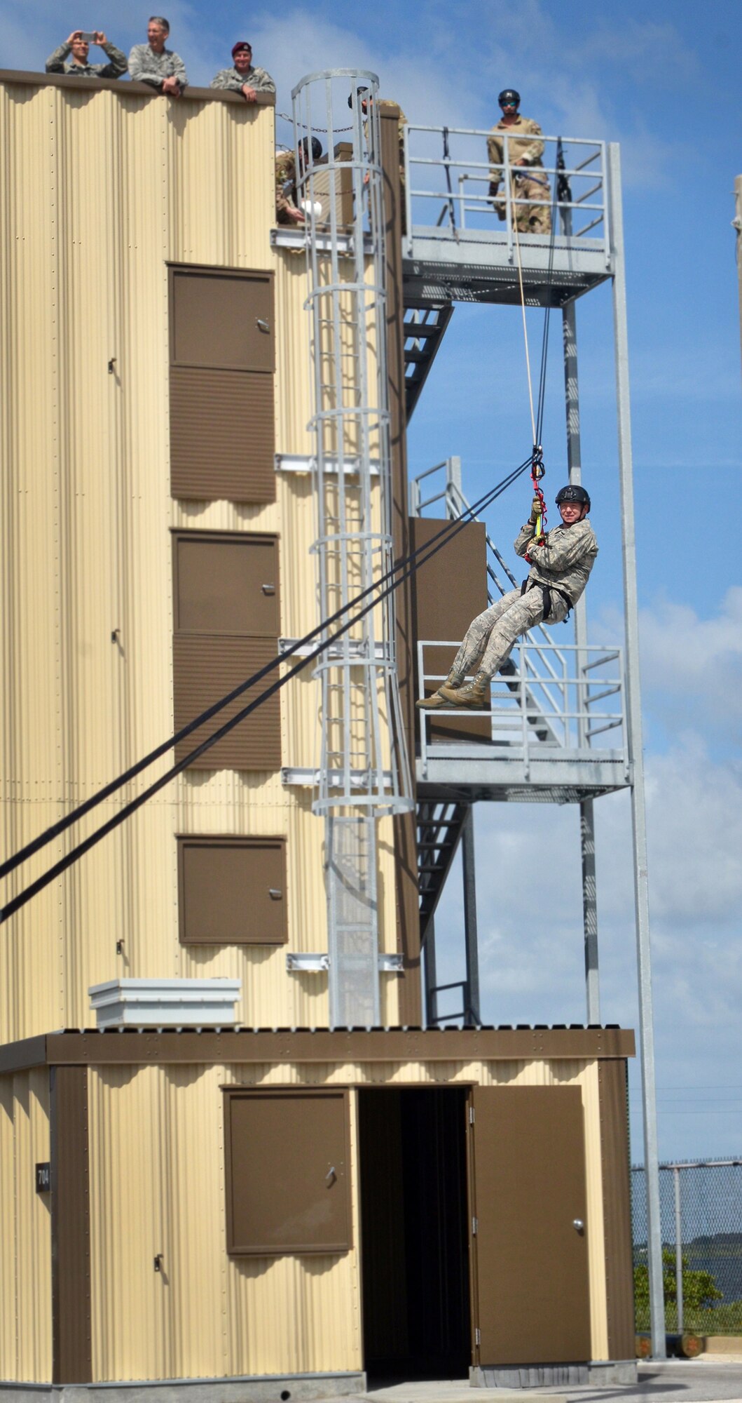 Maj. Gen. Richard Scobee, 10th Air Force commander, zips down a high line traverse provided by 920th Rescue Wing Guardian Angels. The GA’s (pararescuemen, combat rescue officers and survive, evade, resist and escape technicians) are among the most highly trained emergency trauma specialists in the U.S. military. They must maintain an emergency medical technician-paramedic qualification throughout their careers. With this medical and rescue expertise, along with their deployment capabilities, PJs are able to perform life-saving missions in the world's most remote areas.   Scobee visited the Rescue Wing to familiarize himself with the missions and heroes of his rescue and special operations components. (Air Force photo/Master Sgt. Paul Flipse)