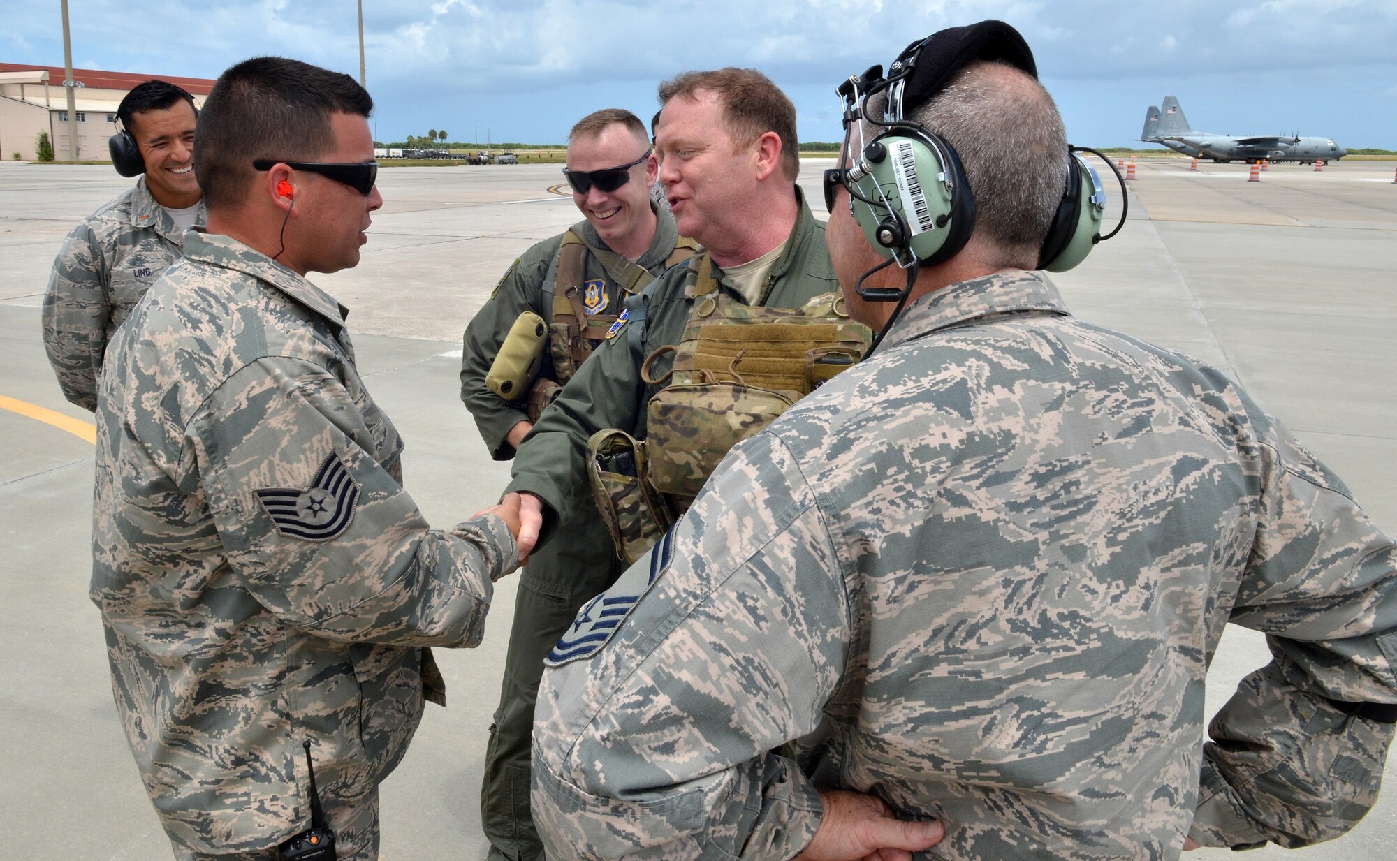 Maj. Gen. Richard Scobee, 10th Air Force commander, coins Tech. Sgt. Christopher Fox, 920th Rescue Wing maintenance, for outstanding on the job performance.  Scobee visited the Rescue Wing to familiarize himself with the missions and heroes of his rescue and special operations components. (Air Force photo/Master Sgt. Paul Flipse)
