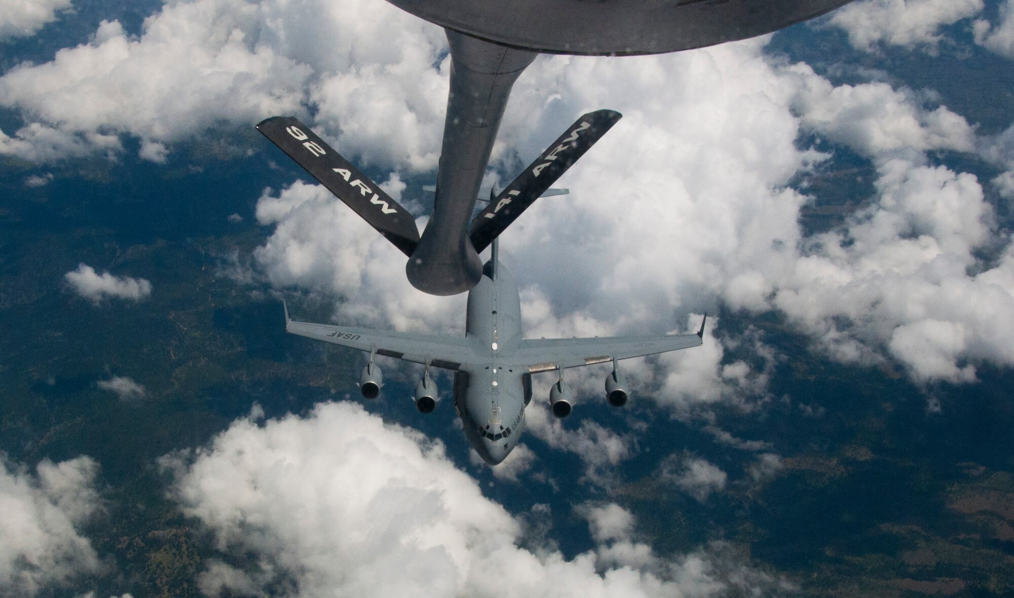 A C-17 Globemaster III cargo aircraft from Joint Base Lewis-McChord, Wash., separates from the boom of a KC-135 Stratotanker from Fairchild Air Force Base, Wash., after an air refueling operation May 26, 2015. The refueling of the Air Force’s premiere cargo aircraft was a planned part of an orientation flight on the KC-135 for members of the West Plains Chamber of Commerce, enabling the 21 members to see Fairchild’s air refueling mission firsthand. (U.S. Air Force Photo/Capt. David A. Liapis)