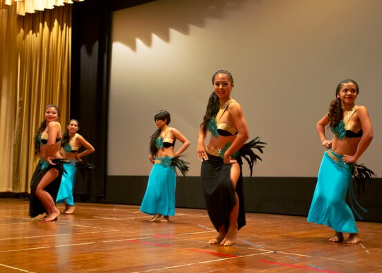 Military members and their families were treated to a traditional Hawaiian hula performance prior to the premier of the movie “Aloha” at the Memorial Base Theater on Joint Base Pearl Harbor-Hickam, Hawaii, May 17, 2015. The Cameron Crowe-directed movie was filmed on JBPHH in 2013. It features a host of well-known Hollywood stars portraying what life for Airmen and their families living and working on JBPHH is like. (U.S. Air Force photo by Tech. Sgt. Terri Paden/RELEASED)