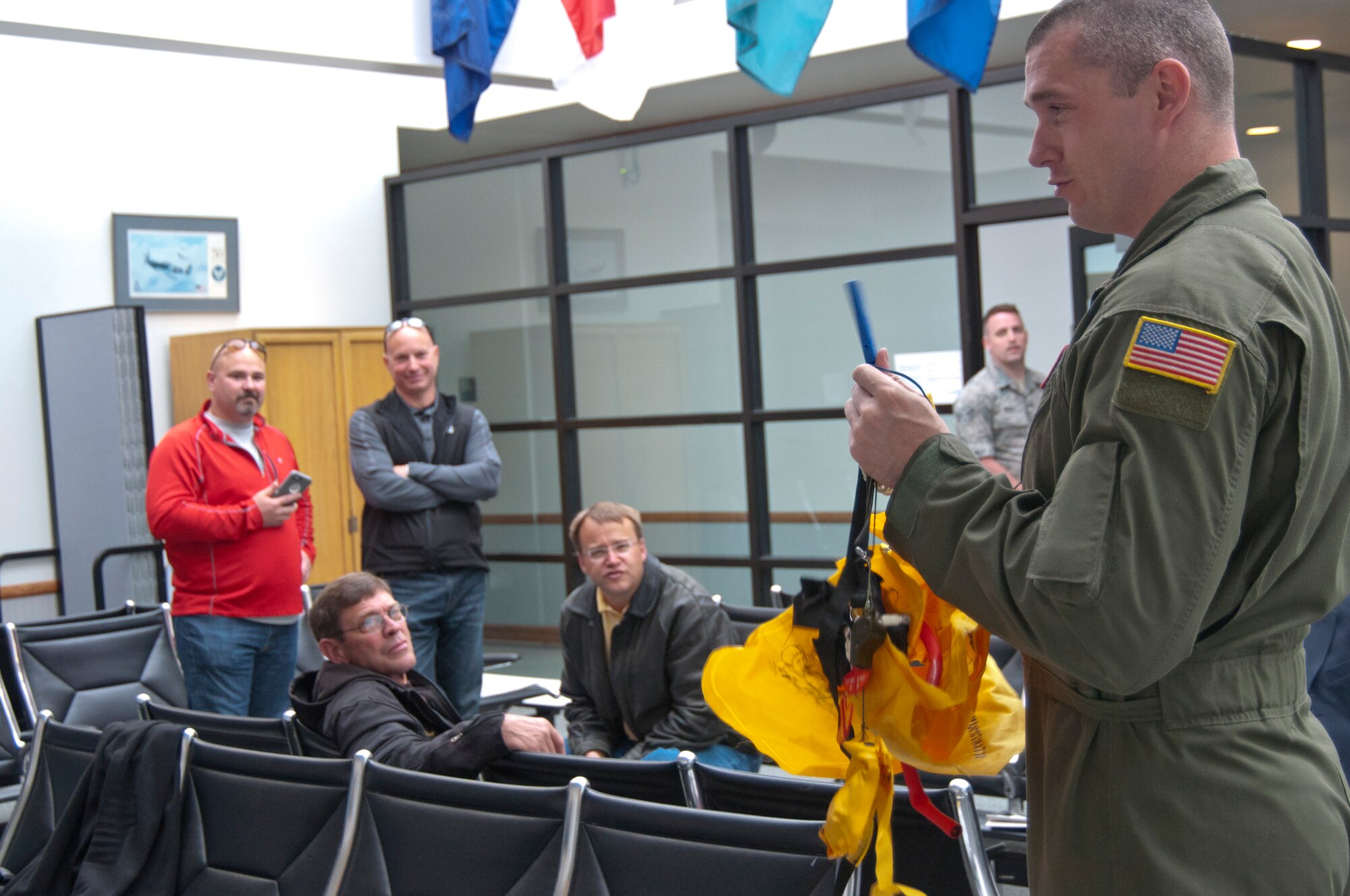 Staff Sgt. Spencer Balcom, 92nd Air Refueling Squadron boom operator, provides a pre-flight safety briefing for members of the West Plains Chamber of Commerce prior to an orientation flight May 26, 2015, at Fairchild Air Force Base, Wash. Providing opportunities such as orientation flights to local civic and business leaders is one of the ways the Air Force builds public trust and support and strong relationships with the local community. (U.S. Air Force Photo/Capt. David A. Liapis)
