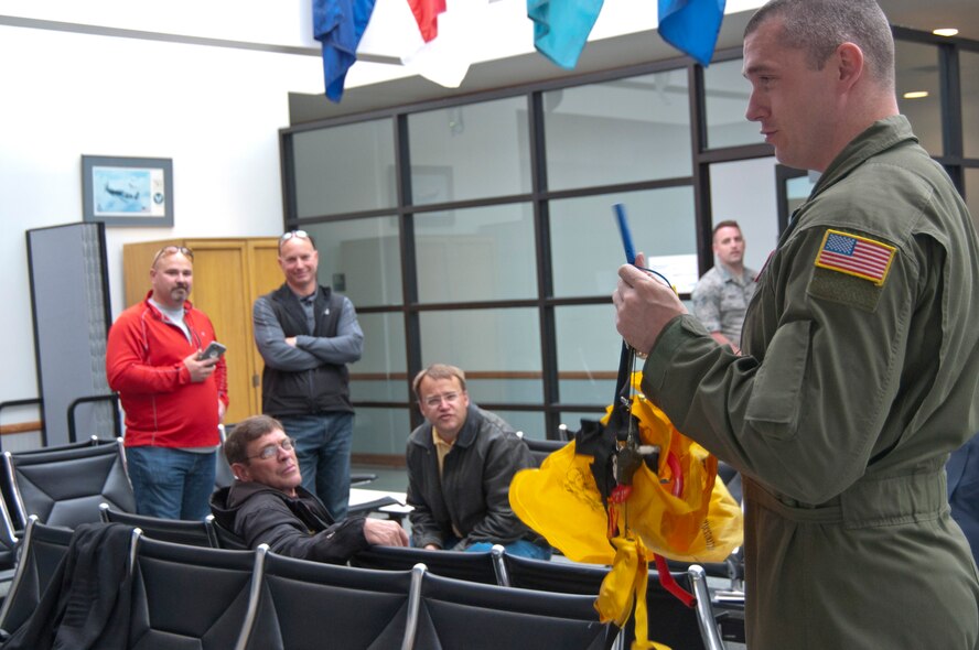 Staff Sgt. Spencer Balcom, 92nd Air Refueling Squadron boom operator, provides a pre-flight safety briefing for members of the West Plains Chamber of Commerce prior to an orientation flight May 26, 2015, at Fairchild Air Force Base, Wash. Providing opportunities such as orientation flights to local civic and business leaders is one of the ways the Air Force builds public trust and support and strong relationships with the local community. (U.S. Air Force photo/Capt. David A. Liapis) 