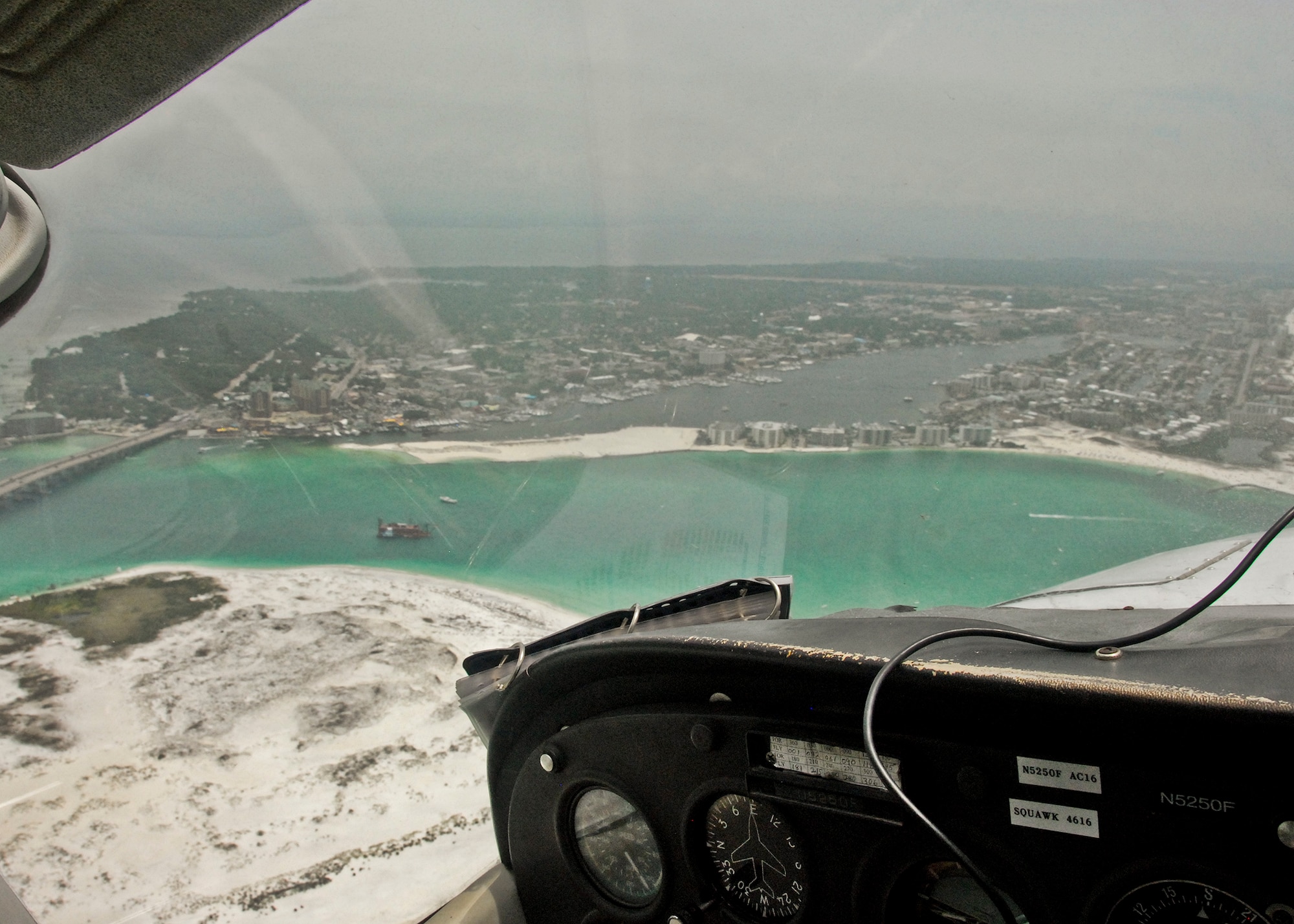 A 20-minute Aero Club orientation flight gives passengers aerial views of the Gulf of Mexico, Hwy. 98, Norriego Point, Destin Harbor and Choctawhatchee Bay May 25 at Eglin Air Force Base, Fla.  The Aero Club also offers anyone with base access the opportunity earn their private pilot’s license and many other airplane operator certifications. (U.S. Air Force photo/Kevin Gaddie)