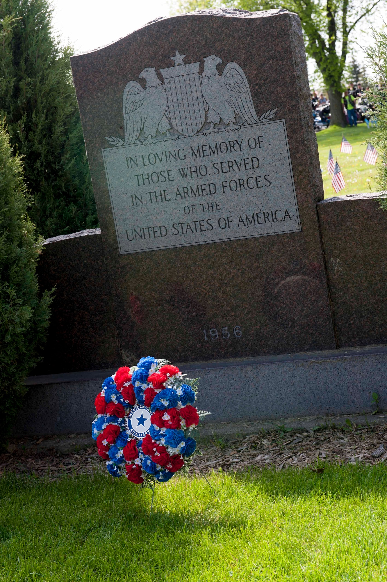 A remembrance wreath rests at a monument during a Memorial Day event at Rosehill Cemetery in Minot, N.D., May 25, 2015. During the event, friends and families of those who have passed while serving in the armed forces placed flags on the graves of their loved ones. (U.S. Air Force photo/Airman 1st Class Sahara L. Fales)