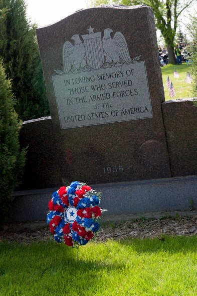 A remembrance wreath rests at a monument during a Memorial Day event at Rosehill Cemetery in Minot, N.D., May 25, 2015. During the event, friends and families of those who have passed while serving in the armed forces placed flags on the graves of their loved ones. (U.S. Air Force photo/Airman 1st Class Sahara L. Fales)