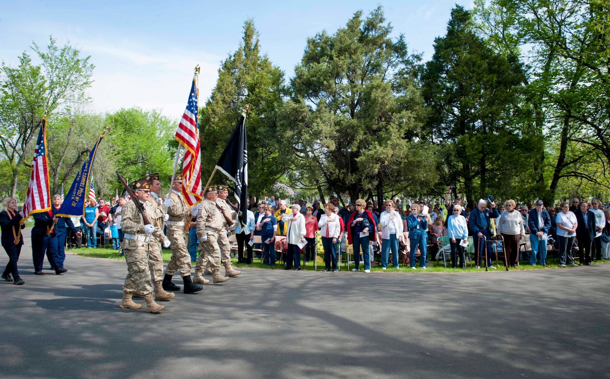 The Colors are presented during a Memorial Day event at Rosehill Cemetery in Minot, N.D., May 25, 2015. Memorial Day is a day of remembrance for the men and women who have passed while serving in the armed forces. (U.S. Air Force photo/Airman 1st Class Sahara L. Fales)