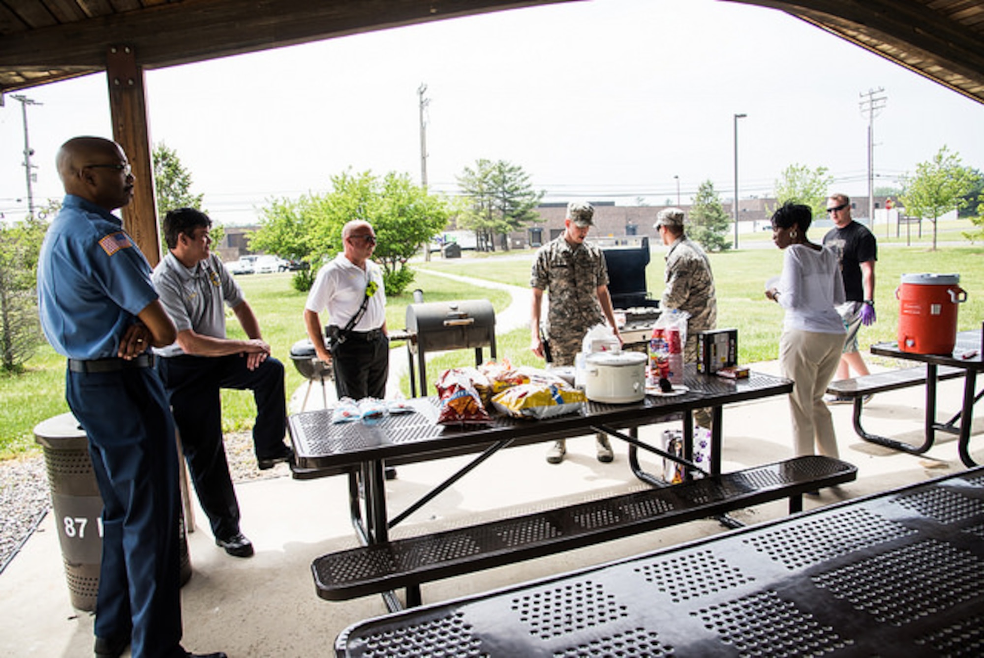 Members of the 87th Medical Group prepare a cookout for start of Emergency Medical Services Week on Joint Base McGuire-Dix-Lakehurst, N.J. May 18, 2015. EMS week recognizes the hard work and dedication of emergency medical technicians and emergency first responders. (U.S. Air Force photo by Russ Meseroll/Released)