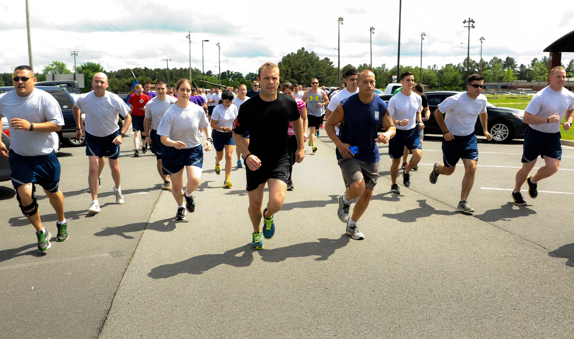 Team Little Rock members take off at the starting line of the 5K Blue Line Run May 11, 2015, at Little Rock Air Force Base, Ark. More than 50 Airmen from multiple squadrons supported military and civilian police by running the race, as part of National Police Week. (U.S. Air Force photo by Senior Airman Scott Poe)