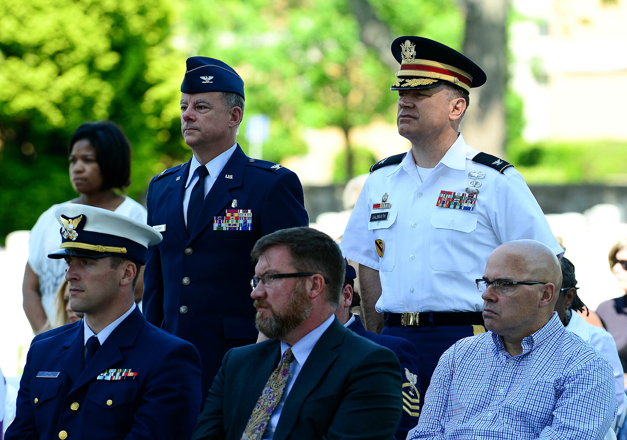 U.S. Army Col. William Galbraith, 733rd Mission Support Group commander, right, and U.S. Air Force Col. James Forrest, 633rd Medical Group deputy commander, attend a Memorial Day Ceremony in Hampton, Va., May 25, 2015.  The Service members stood during a roll call honoring those who served in wars or conflicts dating back to World War II. (U.S. Air Force photo by Senior Airman Kimberly Nagle/Released)  