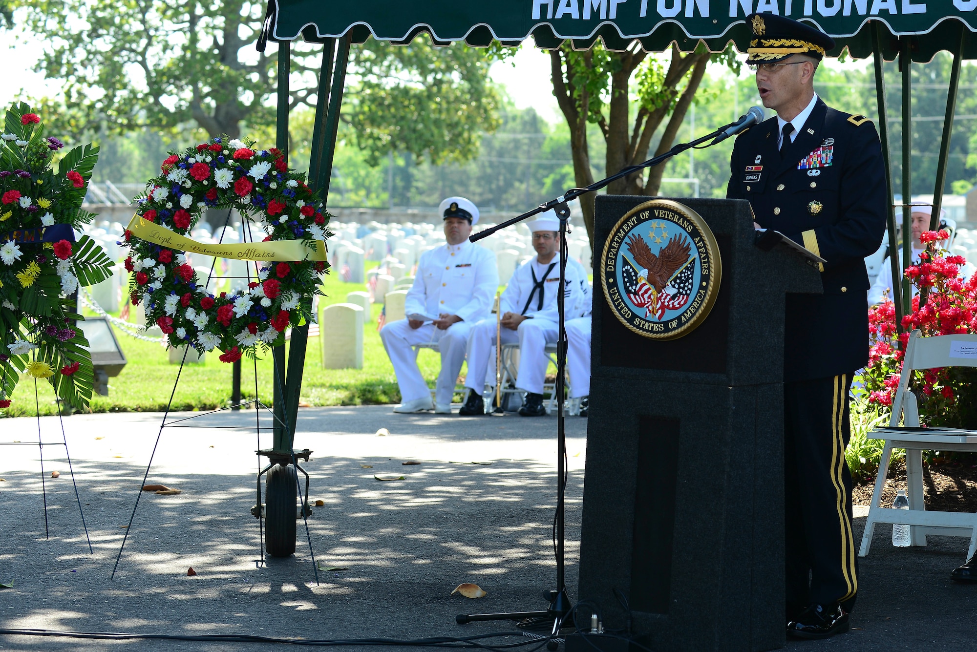 U.S. Army Brig. Gen. Leopoldo Quintas Jr., Army Capabilities Integration Center, United States Army Training and Doctrine Command Concept Development and Learning Directorate director, speaks during a Memorial Day Ceremony in Hampton, Va., May 25, 2015. During the ceremony, Quintas told the story of a fellow Soldier that gave the ultimate sacrifice while attempting to save the lives other Soldiers, while fighting overseas. (U.S. Air Force photo by Senior Airman Kimberly Nagle/Released)  