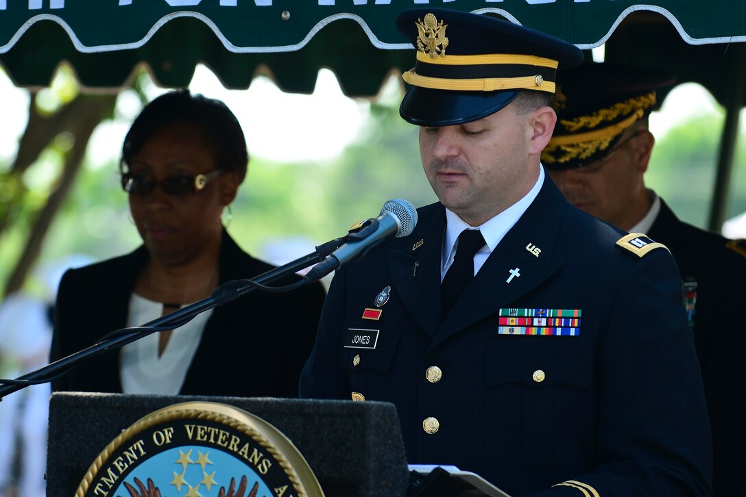 U.S. Army Chaplain (Capt.) Brian Jones, 1-222nd Aviation Regiment, 128th Transportation Brigade chaplain, recites the invocation during a Memorial Day Ceremony in Hampton, Va., May 25, 2015. The chaplain thanked and prayed for those who gave the ultimate sacrifice and those still currently serving in today’s military.  (U.S. Air Force photo by Senior Airman Kimberly Nagle/Released)  