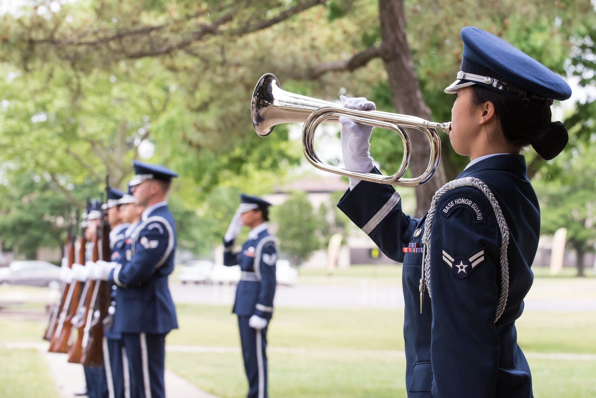 Joint Base McGuire-Dix-Lakehurst ceremonial guardsmen render salutes during the playing of "Taps" at the conclusion of the 33rd Annual Parade of Wreaths May 21, 2015, at Tommy B's Community Activities Center, Joint Base McGuire-Dix-Lakehurst, N.J. (U.S. Air Force photo by Russell Meseroll/Released)