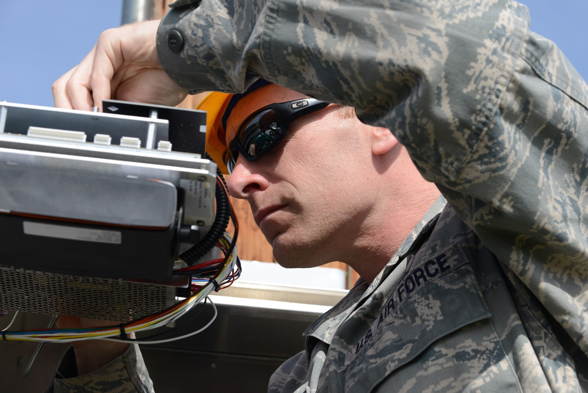 U.S. Air Force Master Sgt. John Sperling, the 354th Communications Squadron NCO in-charge of radio frequency transmission systems, adjusts the tone of a Giant Voice radio May 14, 2015, at Eielson Air Force Base, Alaska. The Giant Voice system is the most direct and fastest means for Command Post to communicate emergencies to the base. (U.S. Air Force photo by Senior Airman Ashley Nicole Taylor/Released)