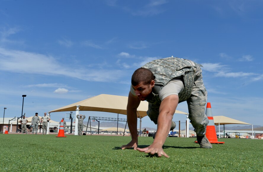 Staff Sgt. Cory Sheppard, 799th Air Base Group  Noncommissioned officer network infrastructure crafts man, performs the bear crawl, May 13, 2015 on Creech Air Force Base, Nevada. The security forces law enforcement challenge consisted of several obstacles including the bear crawl. (U.S. Air Force photo by Senior Airman Adarius Petty /Released)