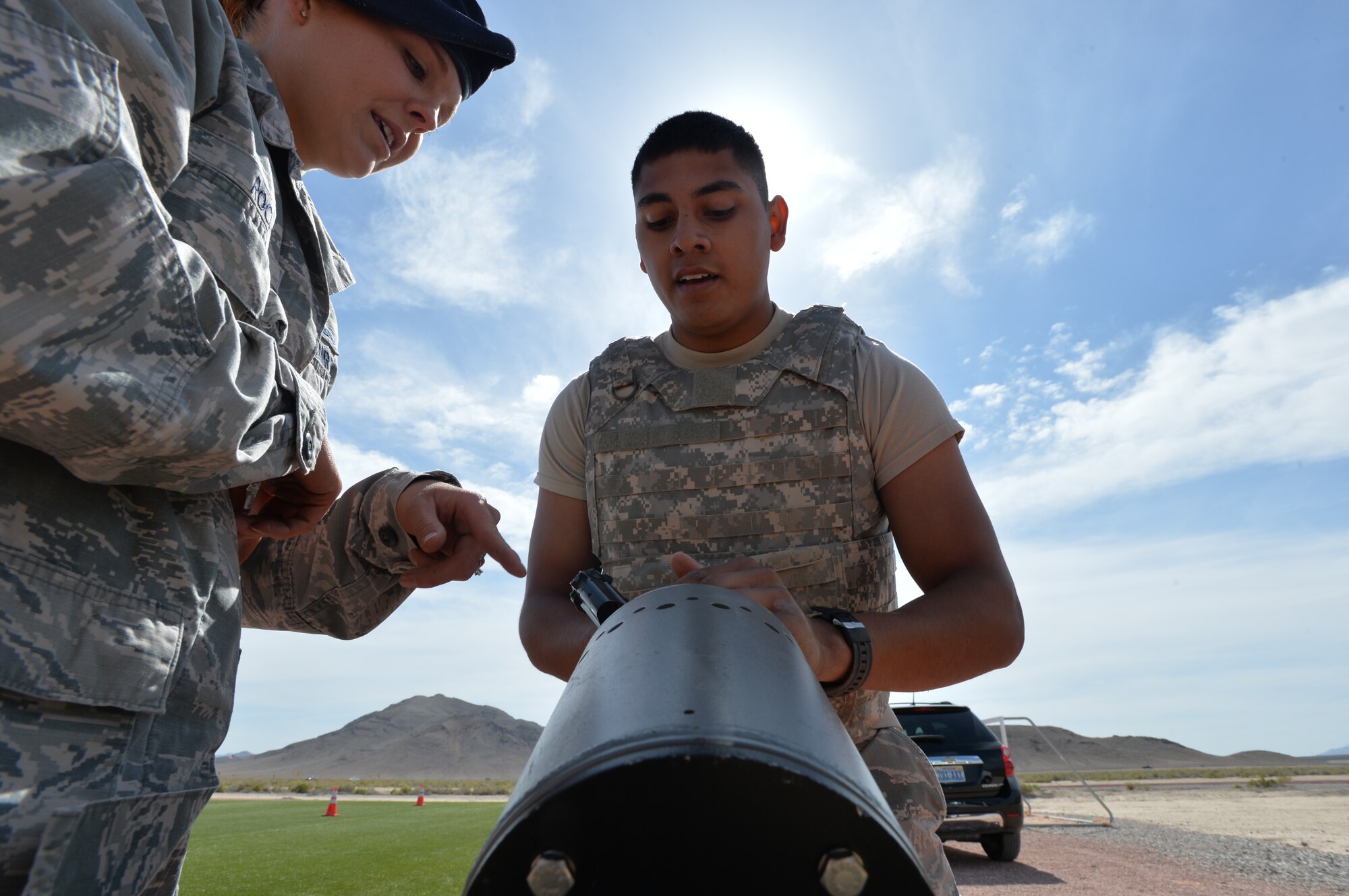 Airman Erik Rosales, 799th Air Base Squadron fitness specialist, clears his weapon during the Security Forces Law enforcement challenge May 13, 2015 on Creech Air Force Base, Nevada.   National Police Week takes place annually to honor the service and sacrifice of civilian and military law enforcement members. (U.S. Air Force photo by Senior Airman Adarius Petty /Released)