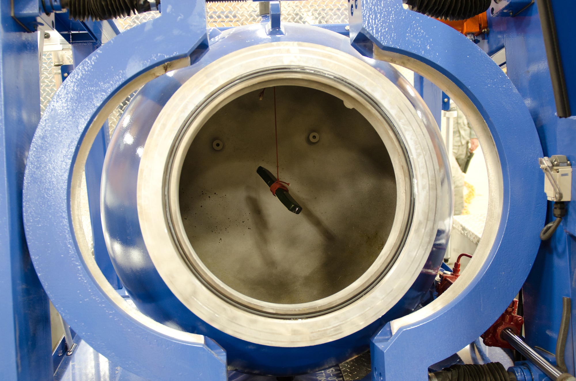 A stick of C4 explosives is suspended in a Bomb Containment Vessel during Explosive Ordnance Disposal training at the Fern Creek Fire Department in Louisville, Ky., Nov. 11, 2014. The vessel is the Kentucky Air National Guard's newest piece of EOD equipment, allowing personnel to detonate explosives on-site with no repercussions to nearby people or structures. (U.S. Air National Guard photo by Master Sgt. Phil Speck)