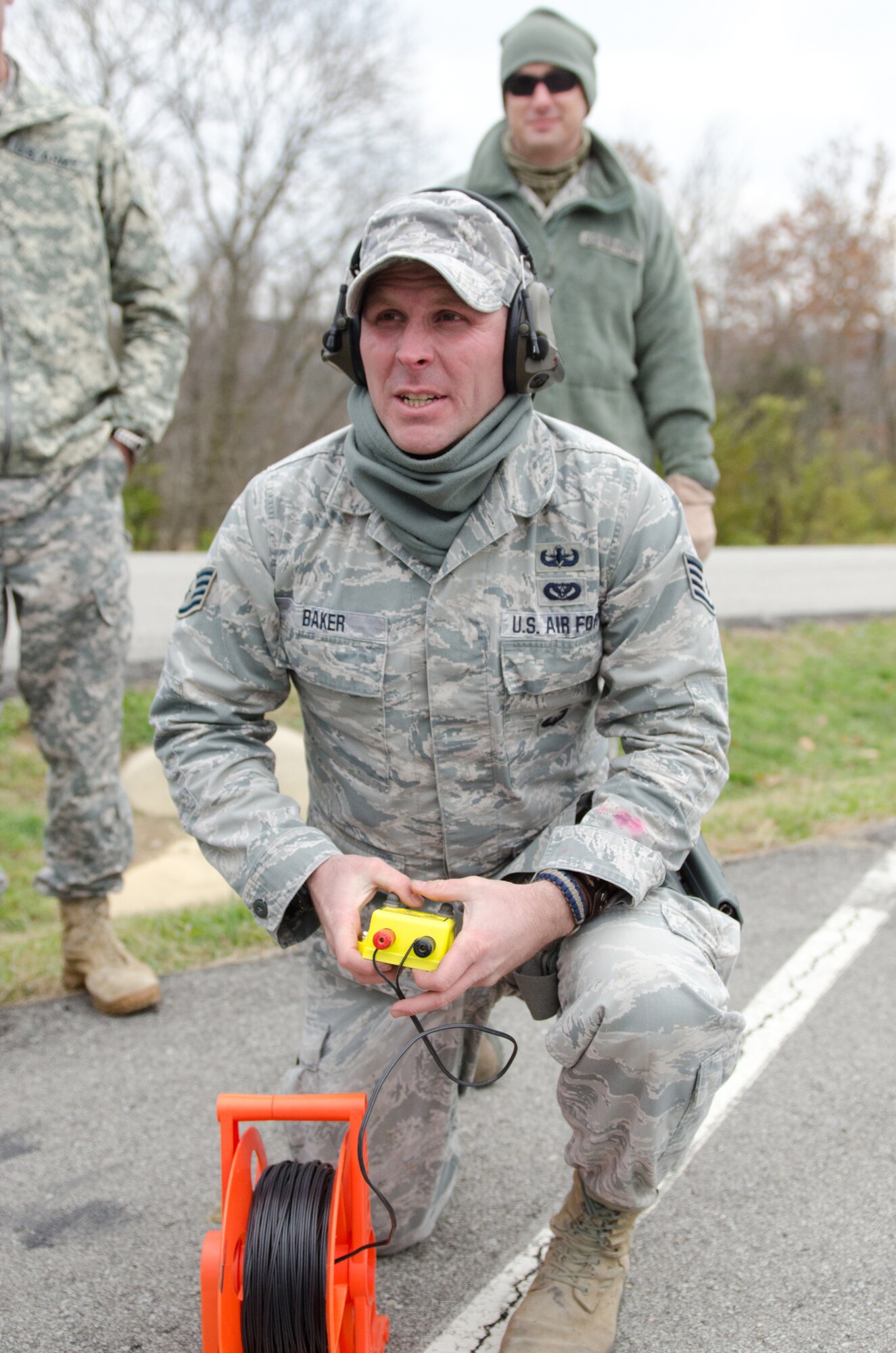 Staff Sgt. Timothy Baker, an Explosive Ordinance Disposal technician for the Kentucky Air National Guard's 123rd Civil Engineer Squadron,  prepares to detonate C4 inside the unit's new Bomb Containment Vessel at a Fern Creek Fire Department training site in Louisville, Ky., Nov. 11, 2014. The steel vessel, which is mounted to a trailer, allows EOD personnel to detonate explosives on-site with no repercussions to nearby people or structures. (U.S. Air National Guard photo by Master Sgt. Phil Speck)
