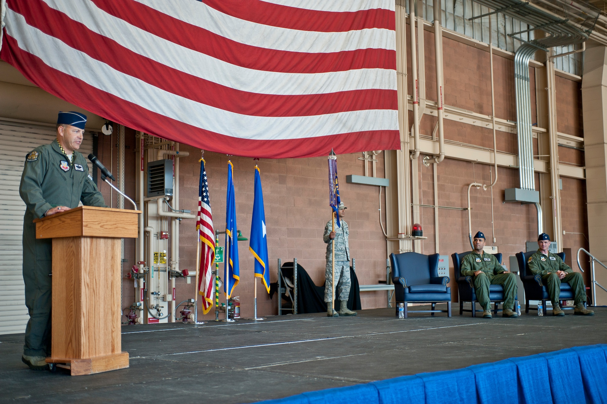 Brig. Gen. Christopher Short (left), 57th Wing commander, speaks during the U.S. Air Force Weapons School’s change of command ceremony at Nellis Air Force Base, Nev., May 26, 2015. During the ceremony, Col. Michael Drowley -- who served at Nellis AFB as a USAFWS instructor in 2004, the 57th WG’s chief of fighter standardization and evaluation in 2006, and the commander of the 66th WPS in 2011 -- became the USAFWS’s new commandant. (U.S. Air Force photo by Staff Sgt. Siuta B. Ika)