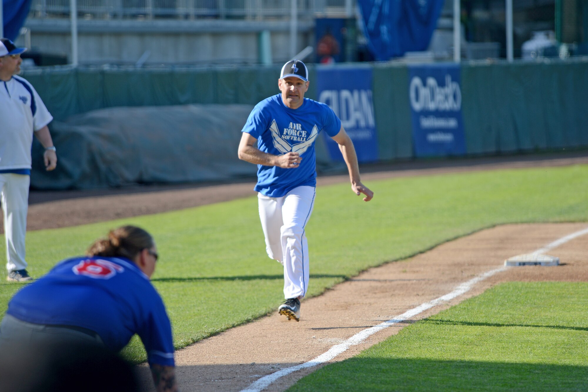 Staff Sgt. Christopher Poche, McChord Field Air Force softball team right fielder, runs to home plate May 20, 2015, during a softball game against the Coast Guard at Cheney Stadium in Tacoma, Wash. The game was to give back to service members and all of the money raised during the tournament was donated to the United Service Organizations. (U.S. Air Force photo/Airman 1st Class Keoni Chavarria)