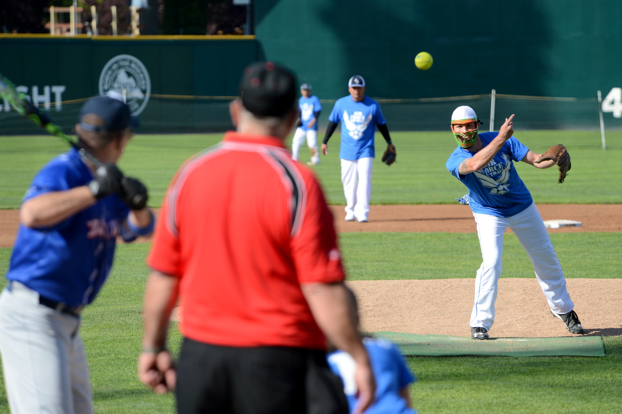 Tech. Sgt. Jason Schmidt, McChord Field Air Force softball team pitcher, throws a softball May 20, 2015, during a softball game against the Coast Guard at Cheney Stadium in Tacoma, Wash. The McChord Field Air Force Softball Team defeated the Coast Guard before getting eliminated in their second game, which was against the Navy. (U.S. Air Force photo/Airman 1st Class Keoni Chavarria)