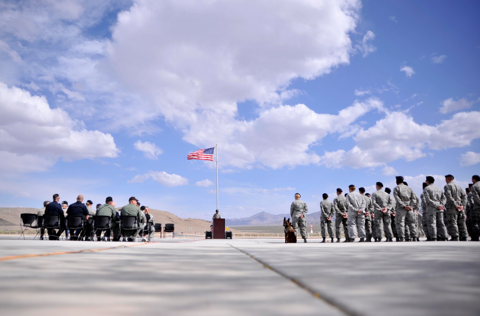 Members of the 799th Security Forces Squadron and local the Las Vegas police department attend a retreat ceremony May 14, 2015, at Creech Air Force Base, Nevada. The ceremony took place during National Police Week which honors fallen law enforcement officers who have paid the ultimate sacrifice. (U.S. Air Force photo by Airman 1st Class Christian Clausen/Released)