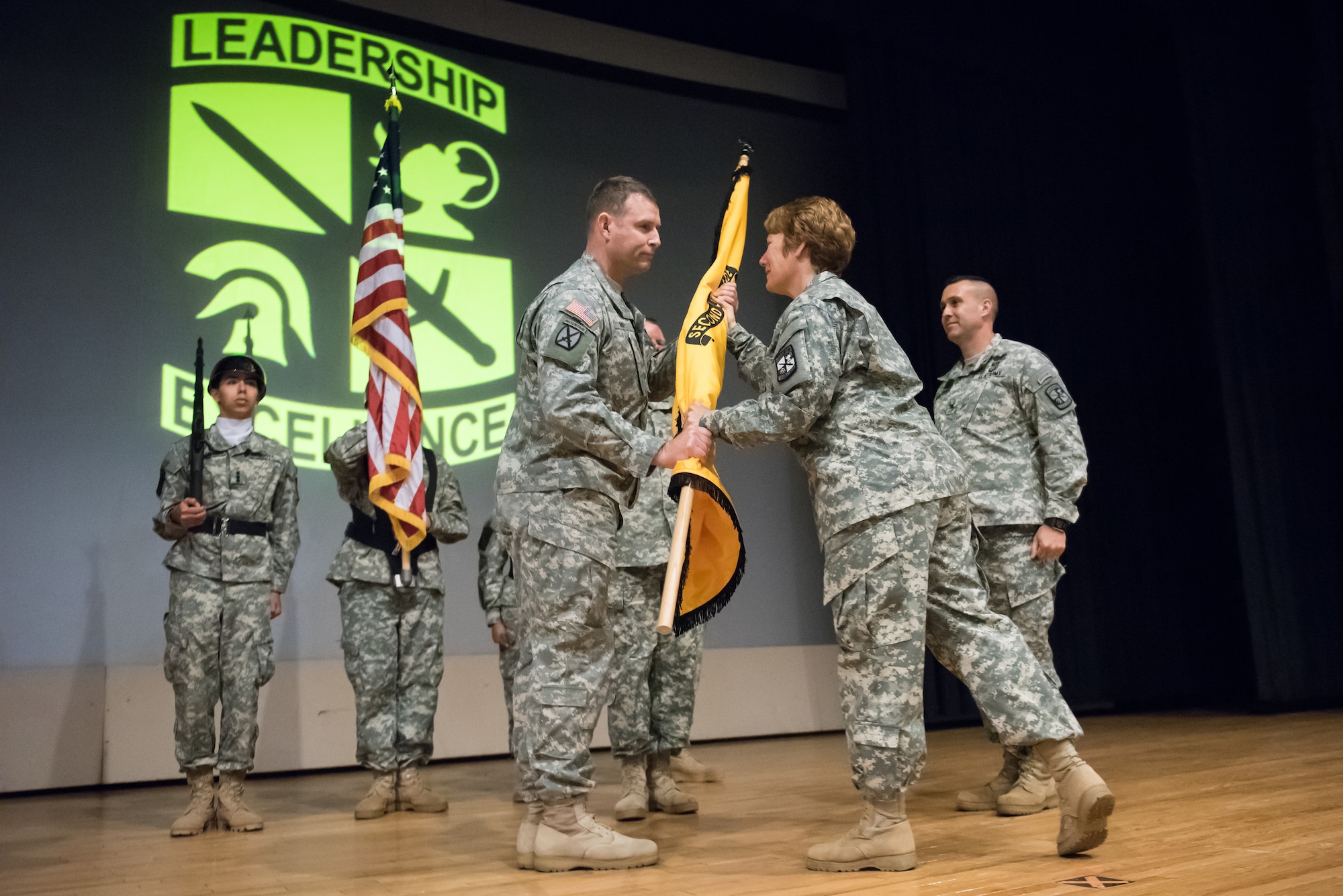 U.S. Army Col. Kenneth Mintz, 2nd Brigade incoming commander, receives the unit guidon from Maj. Gen. Peggy C. Combs, U.S. Army Cadet Command commander, May 20, 2015, on Joint Base McGuire-Dix-Lakehurst, N.J. The 2nd Brigade is responsible for leading and training the Army’s future commissioned leaders. (U.S. Air Force photo by Russ Meseroll/Released)