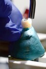 Navy Cmdr. David Leal uses a computer-assisted tool that displays tooth cracks during a procedure Jan. 15 at the Naval Medical Research Unit-San Antonio at Joint Base San Antonio-Fort Sam Houston.
Photo by E.J. Hersom