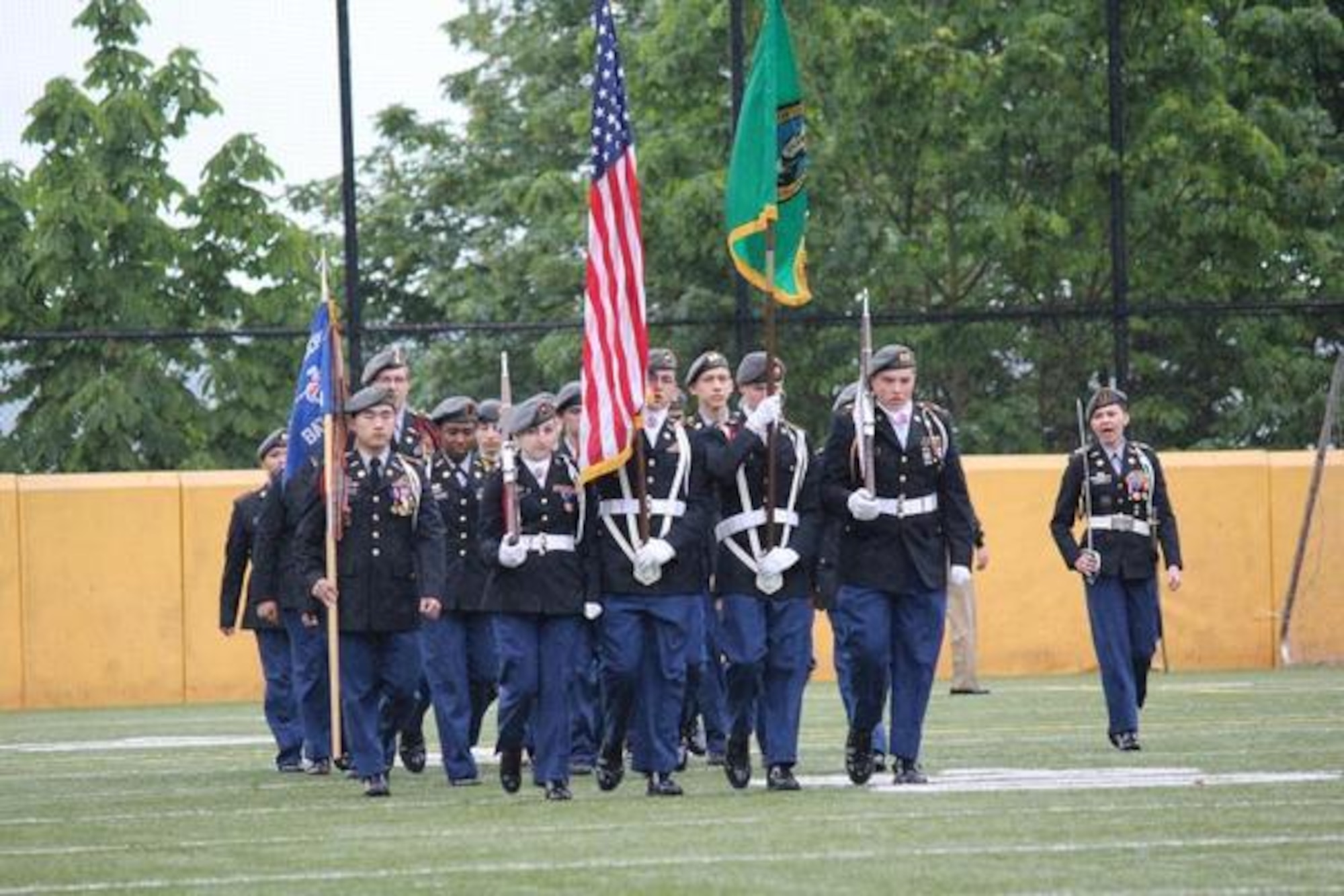 Cadet Melissa Kinney, Lakes High School Army Junior ROTC’s battalion commander, right, Lakes High School Army Junior ROTC, leads her marching team across Stadium High School’s stadium during the Puget Sound Junior ROTC Sunset Pass and Review May 12 in Tacoma. (Northwest Guardian photo by Christina Carmen Crea)