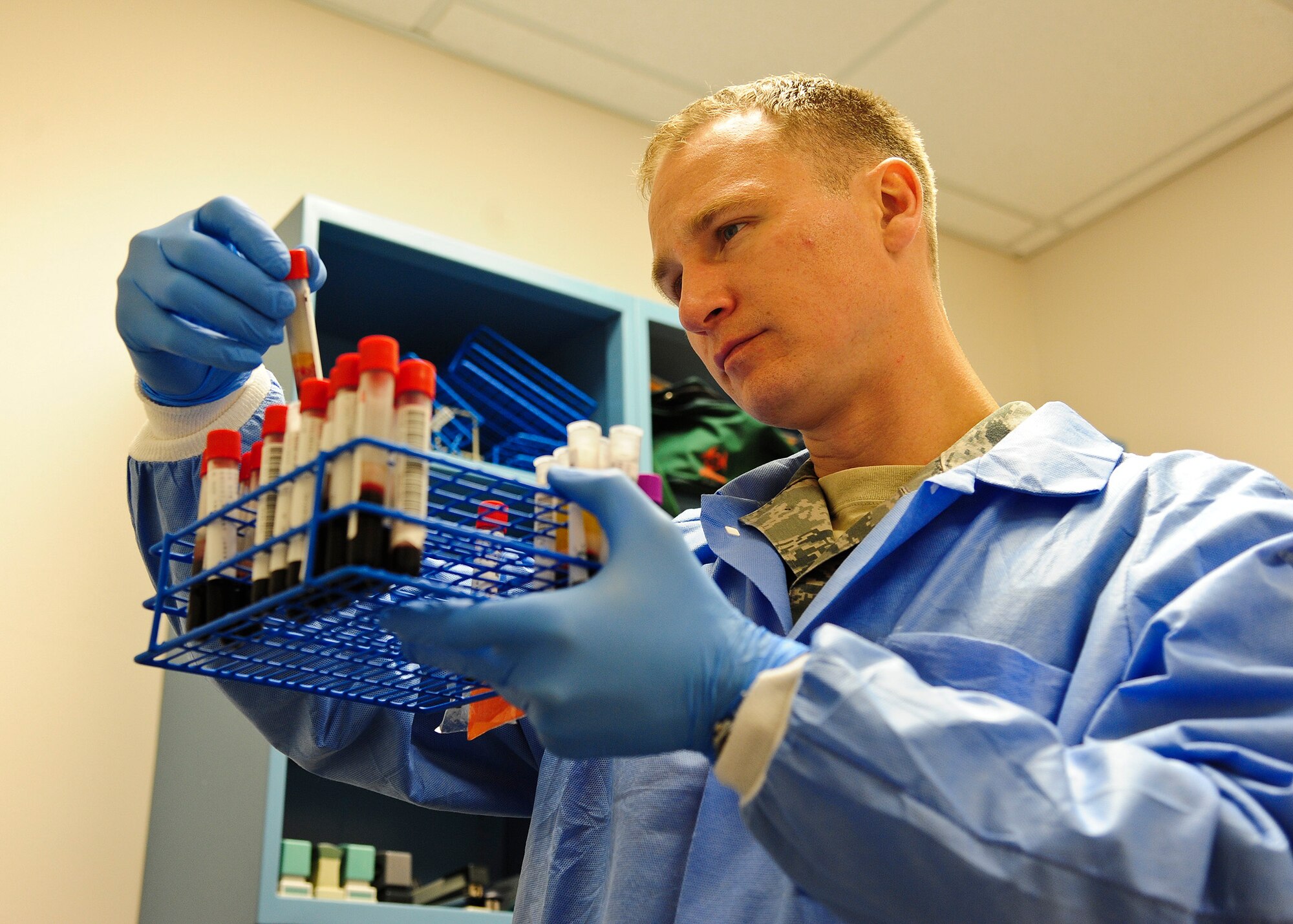 Staff Sgt. Charles Danowski, 319th Medical Support Squadron medical laboratory technician, looks over a blood sample May 28, 2015, on Grand Forks Air Force Base, N.D. Danowski, a Milwaukee native, was selected as the Warrior of the Week for the last week of May 2015. (U.S. Air Force photo by Airman 1st Class Ryan Sparks/released)