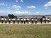 MCGHEE TYSON AIR NATIONAL GUARD BASE, Tenn. - With the Great Smoky Mountains in the foreground, Master. Sgt. Richard Rose, instructor for the Paul H. Lankford Enlisted PME Center, coaches U.S. Air Force NCO academy students here May 27, 2015, on how to carry the guidon flags for their student flights at the I.G. Brown Training and Education Center.  The students began the six-week academy Tuesday. (U.S. Air National Guard photo by Master Sgt. Mike R. Smith/Released)