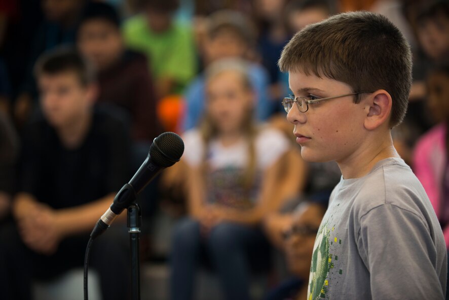 Andy listens to an Afghan air force pilot answer his question during a Q-and-A event May 20, 2015, at Pine Grove Middle School in Valdosta, Ga. Andy and other students asked questions to the pilots about their traditions and culture. (U.S. Air Force photo by Airman 1st Class Dillian Bamman/Released)