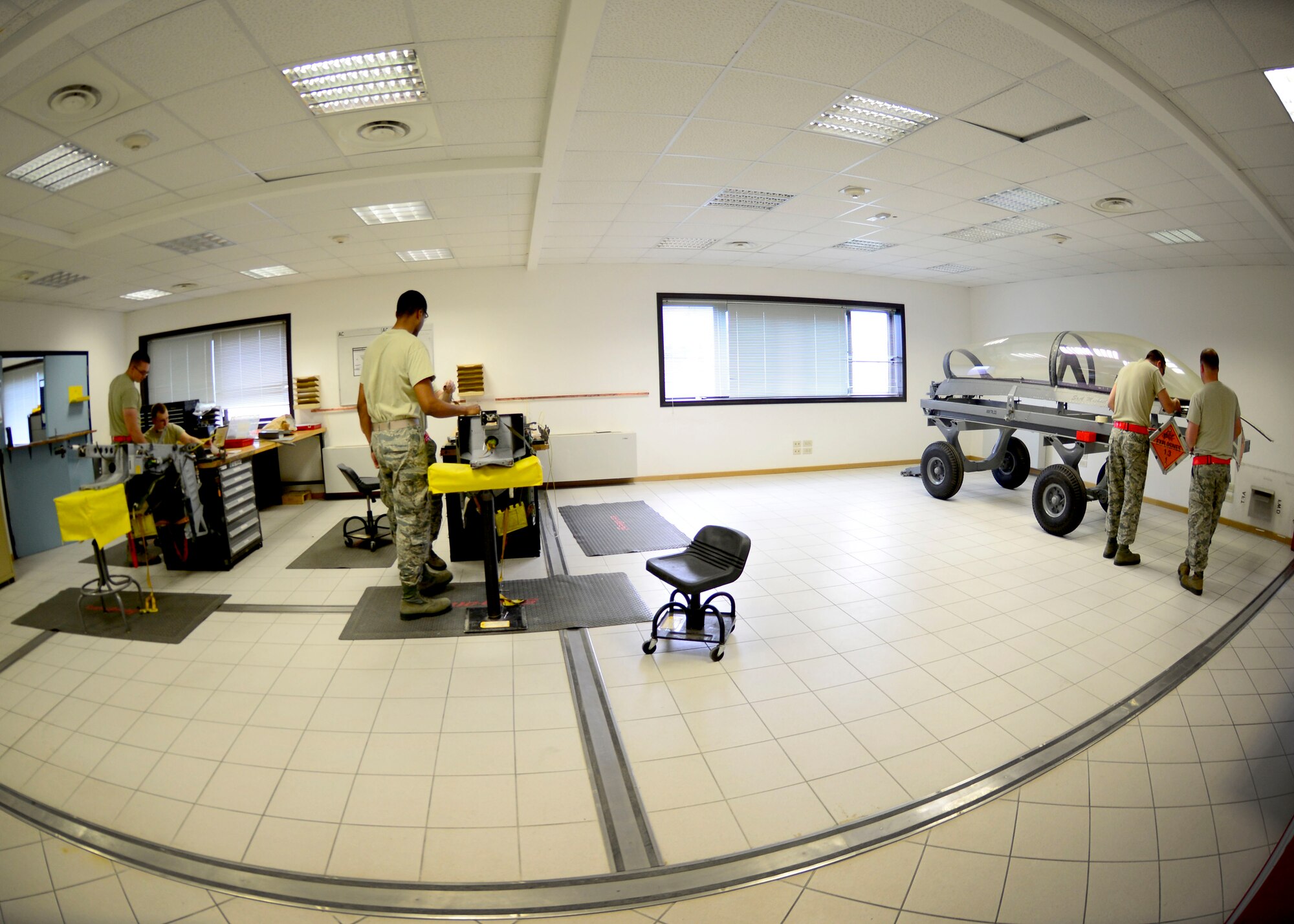 U.S. Air Force Airmen assigned to the 31st Maintenance Squadron aircrew egress systems shop, ensure all the mechanical components function properly, May, 27 2015, at Aviano Air Base, Italy. The Airmen perform thorough inspections on various pieces of egress equipment to ensure safety, security and serviceability. (U.S. Air Force photo by Senior Airman Areca T. Wilson/Released)