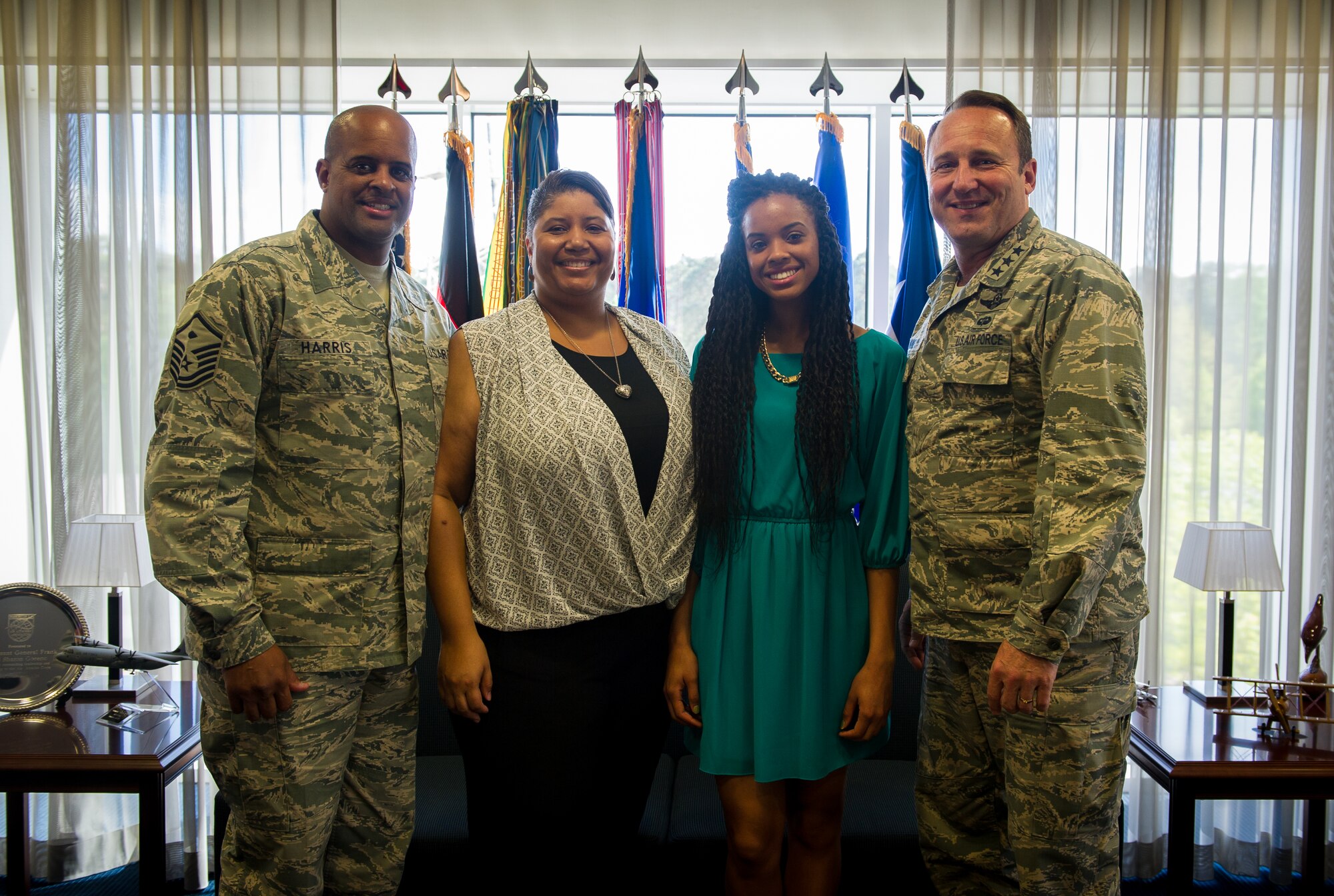 Riansimone Harris, Kaiserslautern High School student,  and her family meet with Gen. Tom Jones, U.S. Air Forces in Europe and Air Forces Africa vice commander, about her involvement in the Kaiserslautern Military Community May 4, 2015 during an office call following her selection as the European Youth of the Year. The Youth of the Year competition is a Boys and Girls Club program that aims to celebrate exemplary high school students who embody the values of leadership, service, academic excellence, and healthy lifestyles. (U.S. Air Force photo by Tech. Sgt. Ryan Crane)