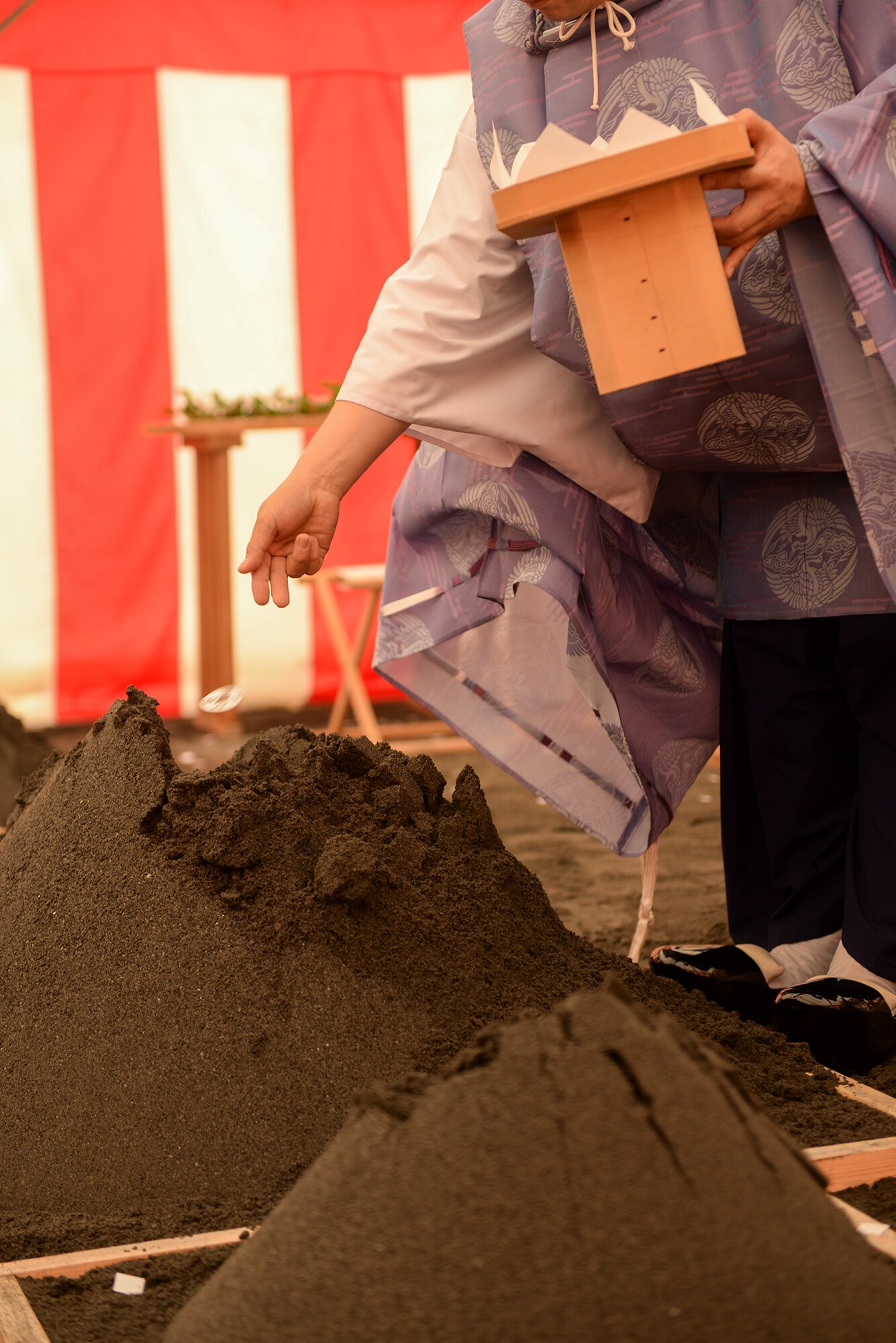 A Shinto priest performs the ground breaking ceremony for the new Yokota High School at Yokota Air Base, Japan, May 19, 2015. The new high school project is intended to include the demolition of existing buildings and support facilities, and the construction of a multi-purpose playing field, parking lots, sidewalks and a loop road. 